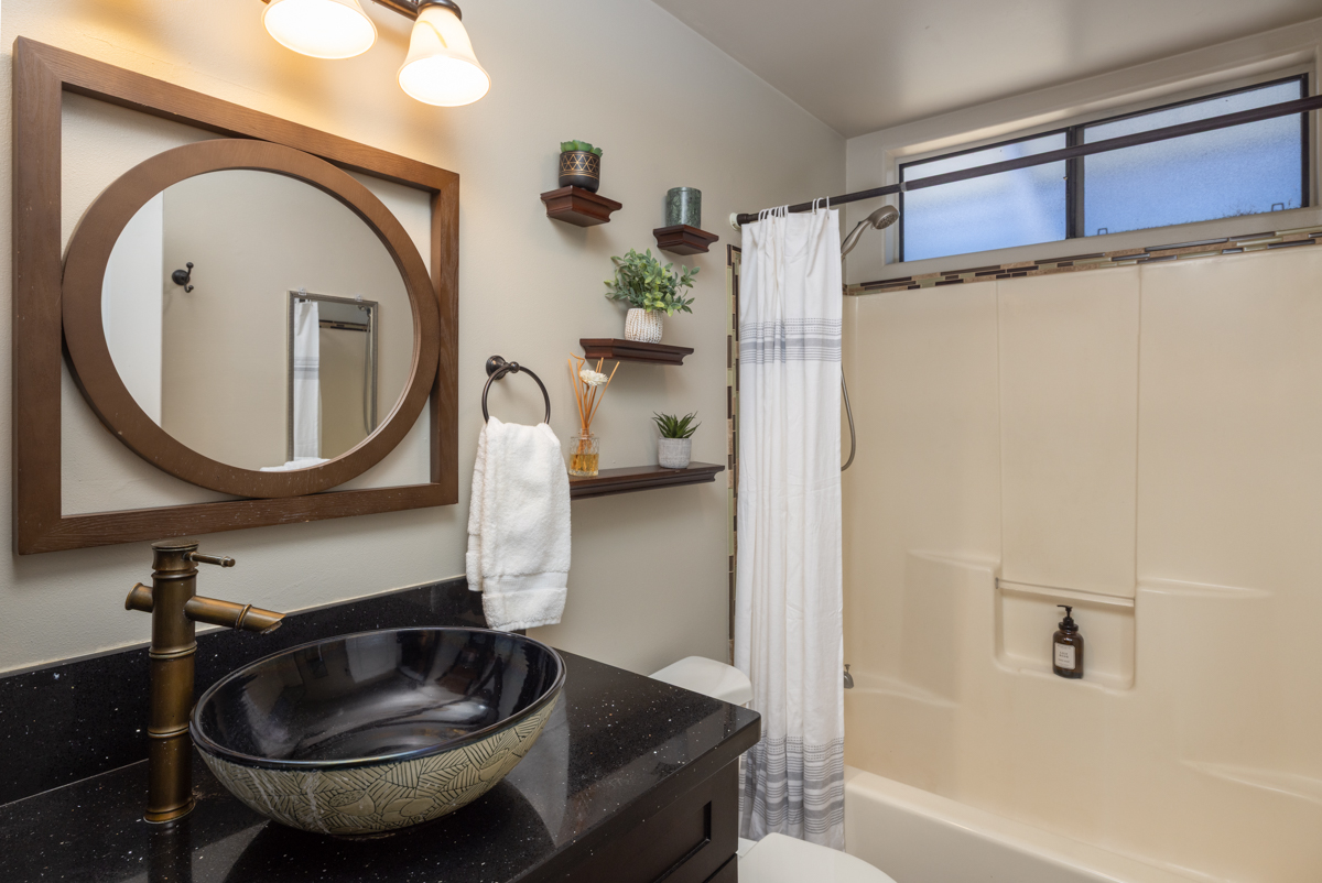 45-1006 Kalehua Road Honokaa, HI 96727 - Photo 14 of 29 a bathroom with a sink and a mirror