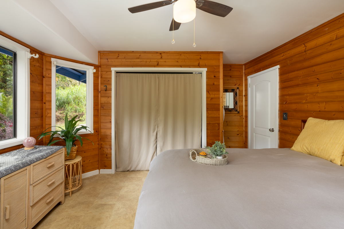 45-1006 Kalehua Road Honokaa, HI 96727 - Photo 17 of 29 a view of an entryway with wooden floor and cabinet area