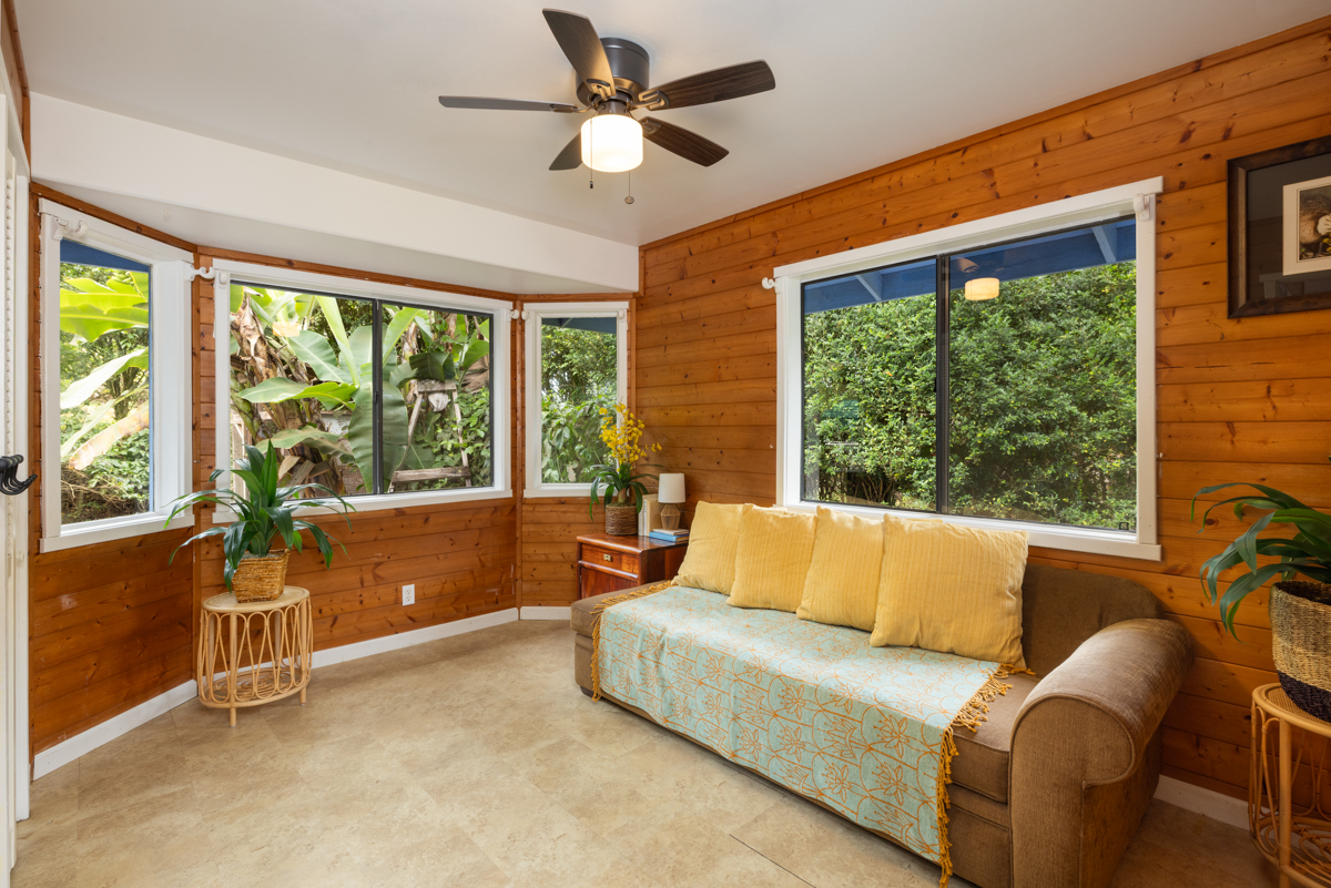 45-1006 Kalehua Road Honokaa, HI 96727 - Photo 18 of 29 a living room with furniture and a large window