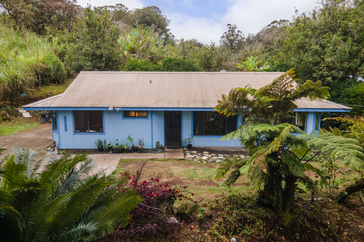 45-1006 Kalehua Road Honokaa, HI 96727 - Photo 20 of 29 a front view of a house with a yard and garage