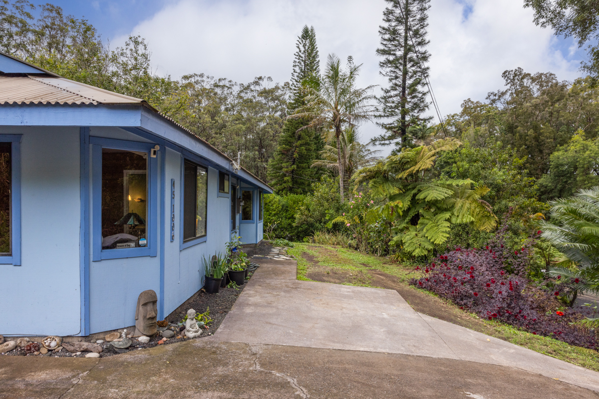 45-1006 Kalehua Road Honokaa, HI 96727 - Photo 24 of 29 a view of a house with a yard and garage