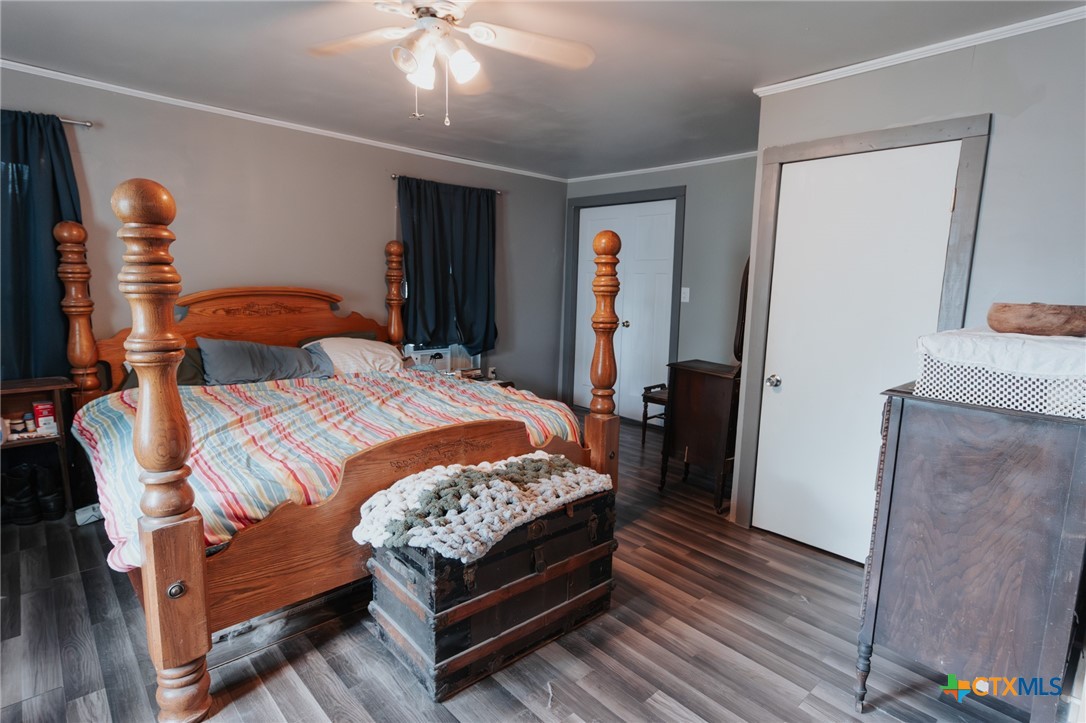 200 Williams Street Cuero, TX 77954 - Photo 16 of 17 a bedroom with a bed and wooden floor