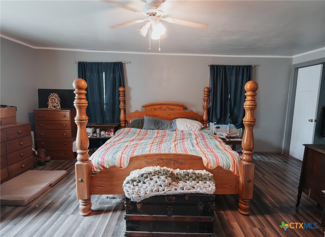 200 Williams Street Cuero, TX 77954 - Photo 17 of 17 a bed room with furniture and wooden floor