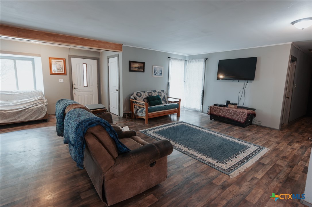 200 Williams Street Cuero, TX 77954 - Photo 3 of 17 a living room with furniture and a flat screen tv