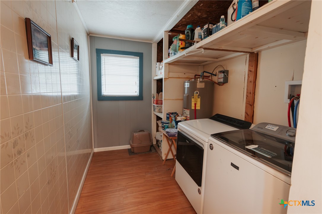 200 Williams Street Cuero, TX 77954 - Photo 8 of 17 a kitchen that has a sink and a stove