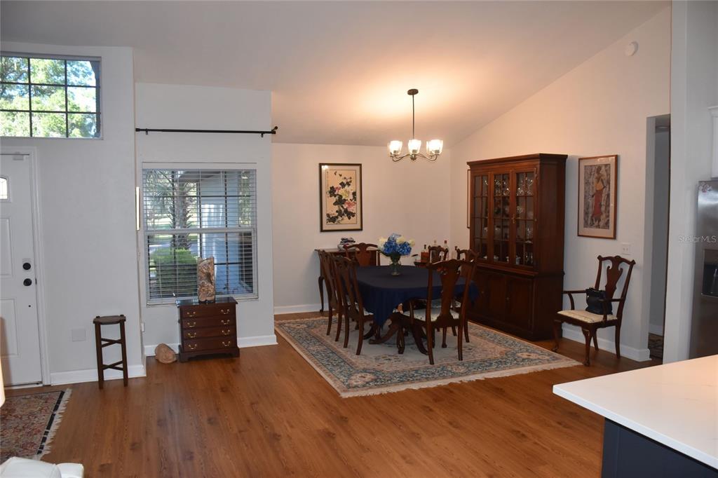 2031 Southwest 75th Terrace Gainesville, FL 32607 - Photo 11 of 45 a view of a livingroom with furniture dining room and wooden floor