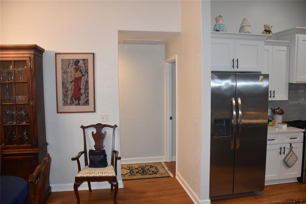 2031 Southwest 75th Terrace Gainesville, FL 32607 - Photo 12 of 45 a view of kitchen with furniture and wooden floor