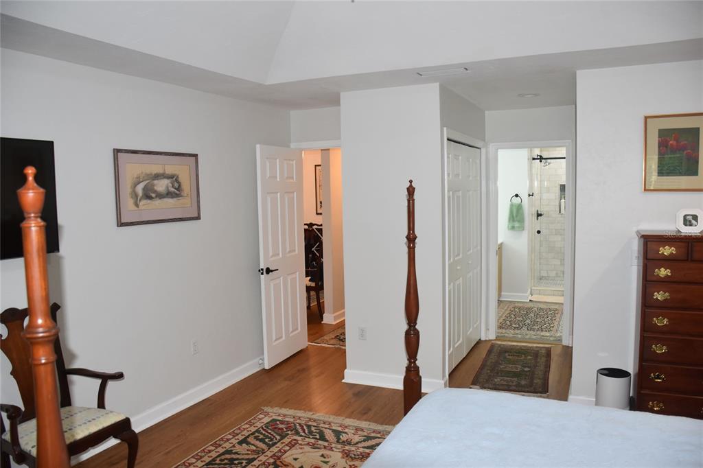 2031 Southwest 75th Terrace Gainesville, FL 32607 - Photo 19 of 45 a bedroom with a bed and a table in it