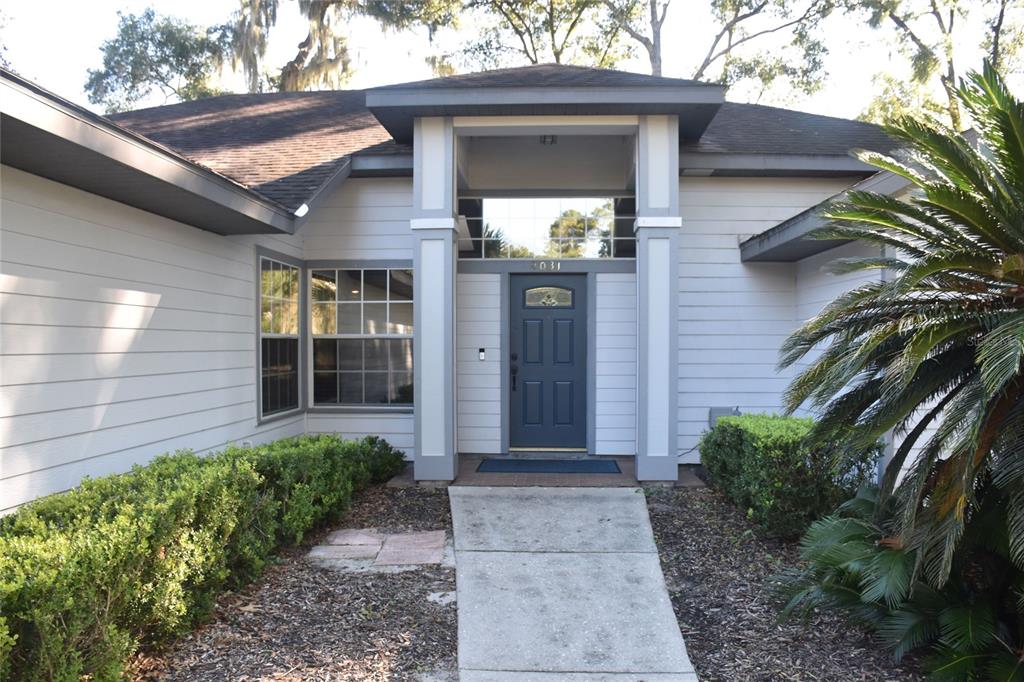 2031 Southwest 75th Terrace Gainesville, FL 32607 - Photo 2 of 45 a view of a house with brick walls and potted plants