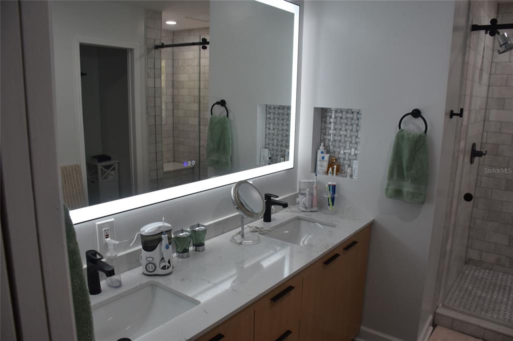 2031 Southwest 75th Terrace Gainesville, FL 32607 - Photo 22 of 45 a bathroom with a sink and mirror