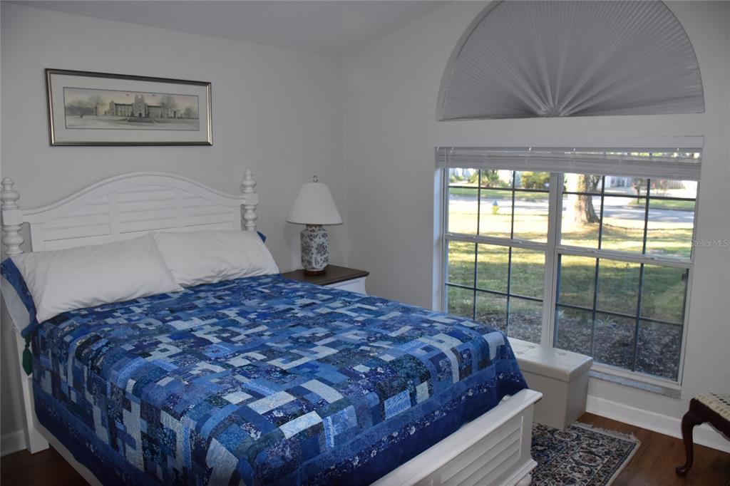 2031 Southwest 75th Terrace Gainesville, FL 32607 - Photo 35 of 45 a bedroom with a bed painting and a large window