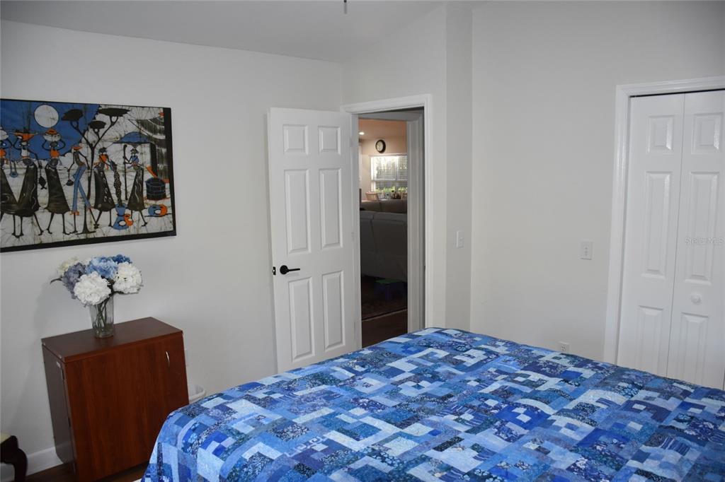 2031 Southwest 75th Terrace Gainesville, FL 32607 - Photo 36 of 45 a bedroom with a bed and painting on the wall