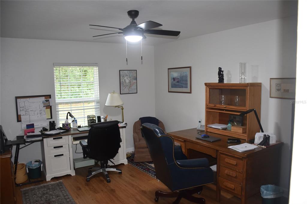 2031 Southwest 75th Terrace Gainesville, FL 32607 - Photo 39 of 45 a view of a workspace with furniture and a window