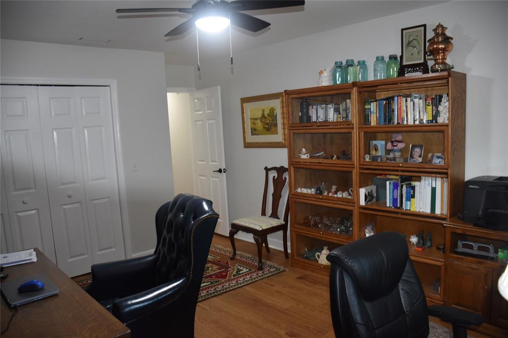 2031 Southwest 75th Terrace Gainesville, FL 32607 - Photo 41 of 45 a view of a workspace with furniture and toys