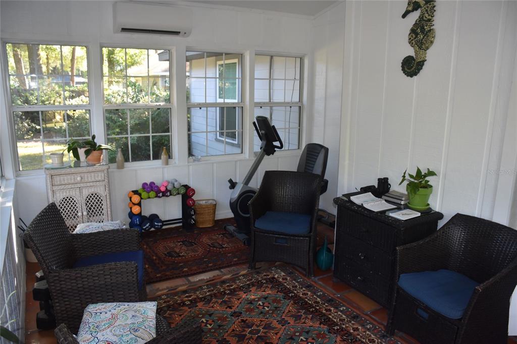 2031 Southwest 75th Terrace Gainesville, FL 32607 - Photo 45 of 45 a living room with furniture lamp and a large window