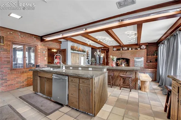 a open kitchen with stainless steel appliances granite countertop a sink and cabinets