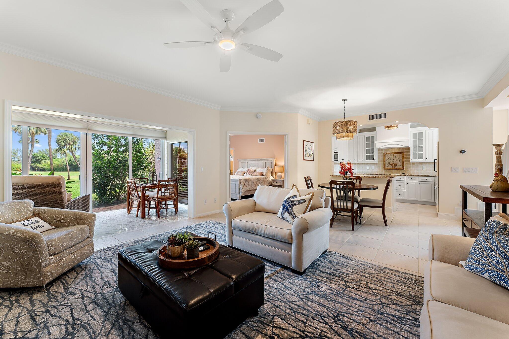 2905 Fairway Drive North Jupiter, FL 33477 - Photo 18 of 65 a living room with furniture and a large window