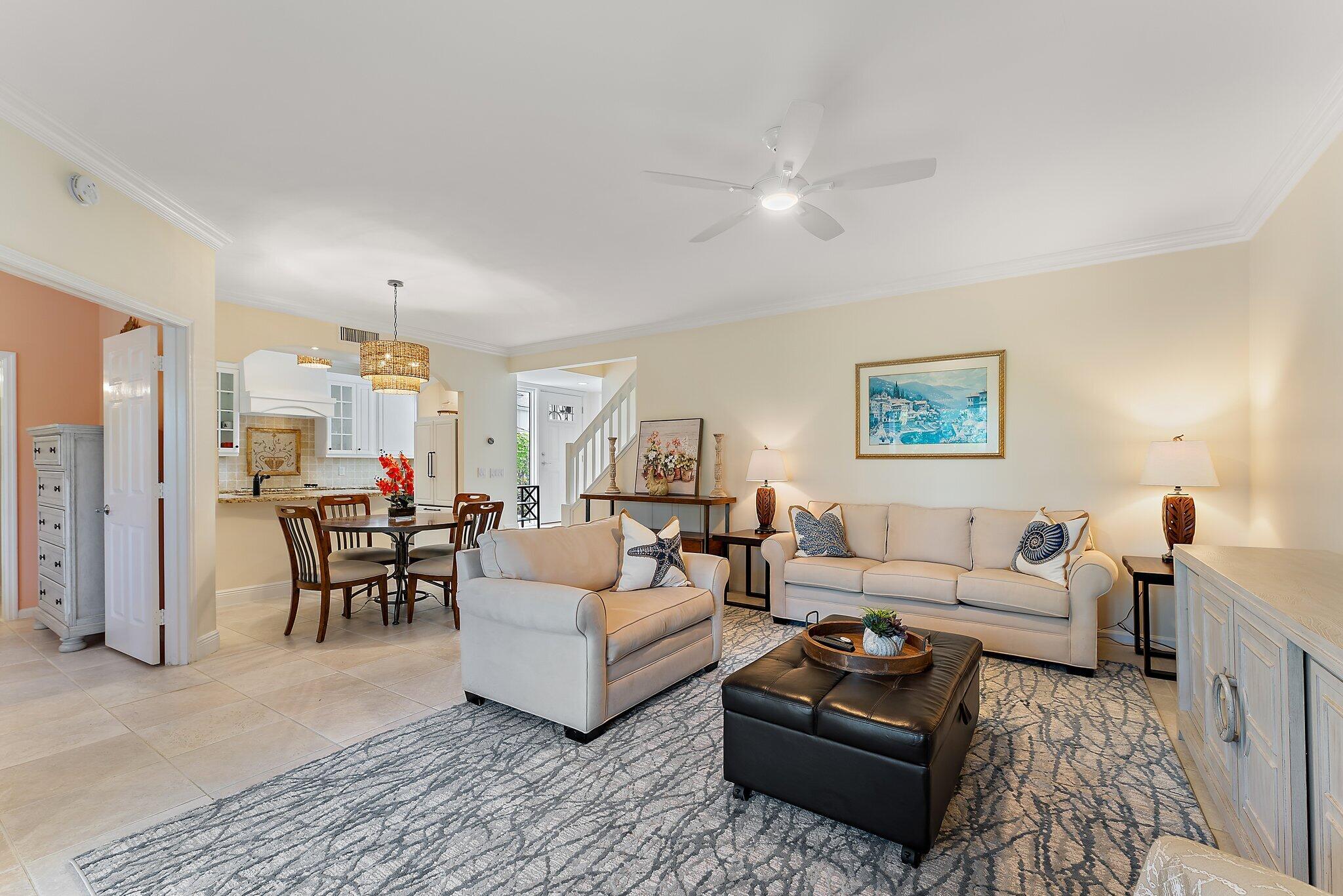 2905 Fairway Drive North Jupiter, FL 33477 - Photo 19 of 65 a living room with furniture and a table