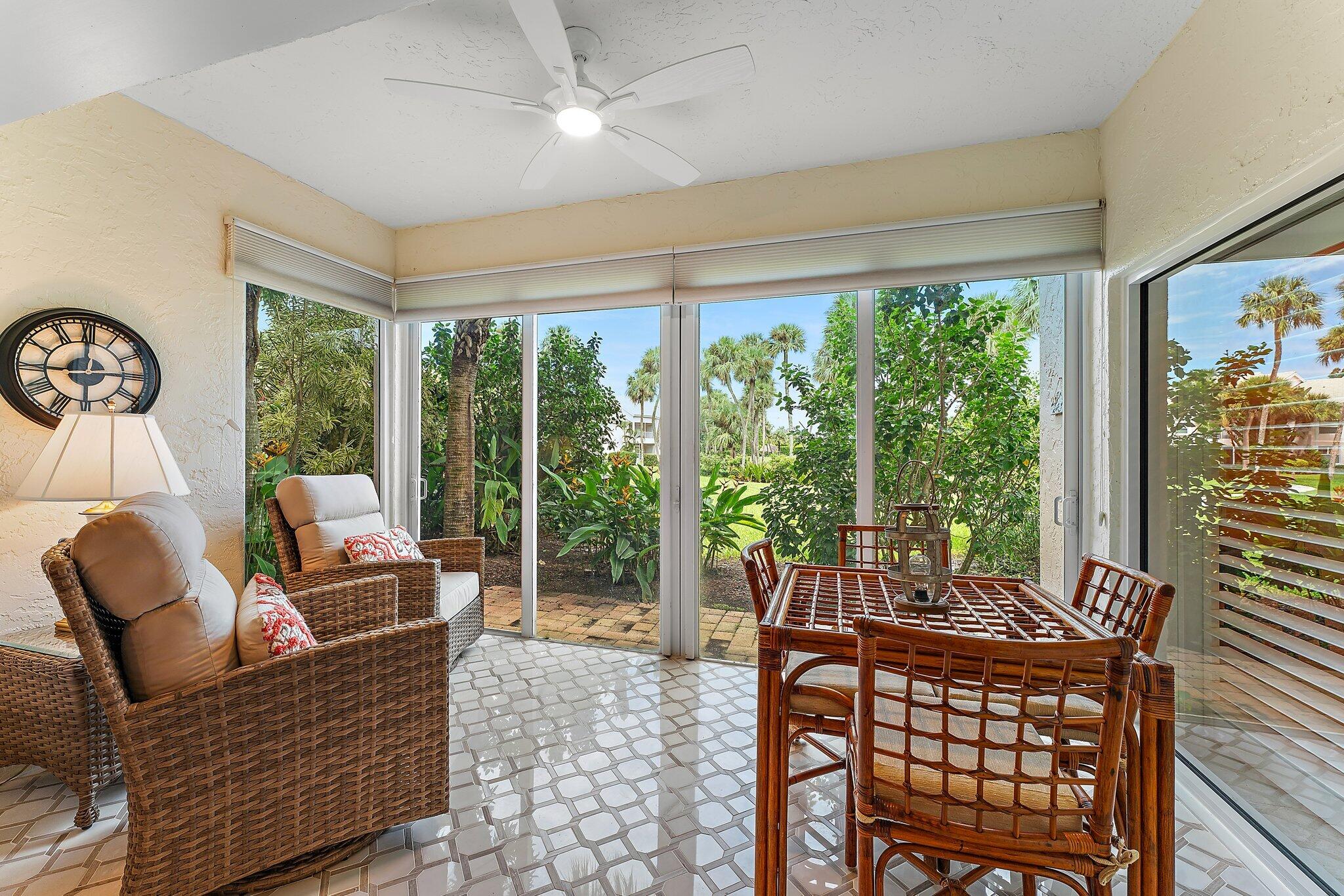 2905 Fairway Drive North Jupiter, FL 33477 - Photo 22 of 65 a living room with furniture and a window