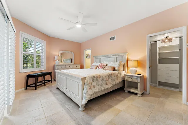 a bed room with a bed and a table