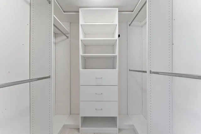 a bathroom with a sink mirror and toilet