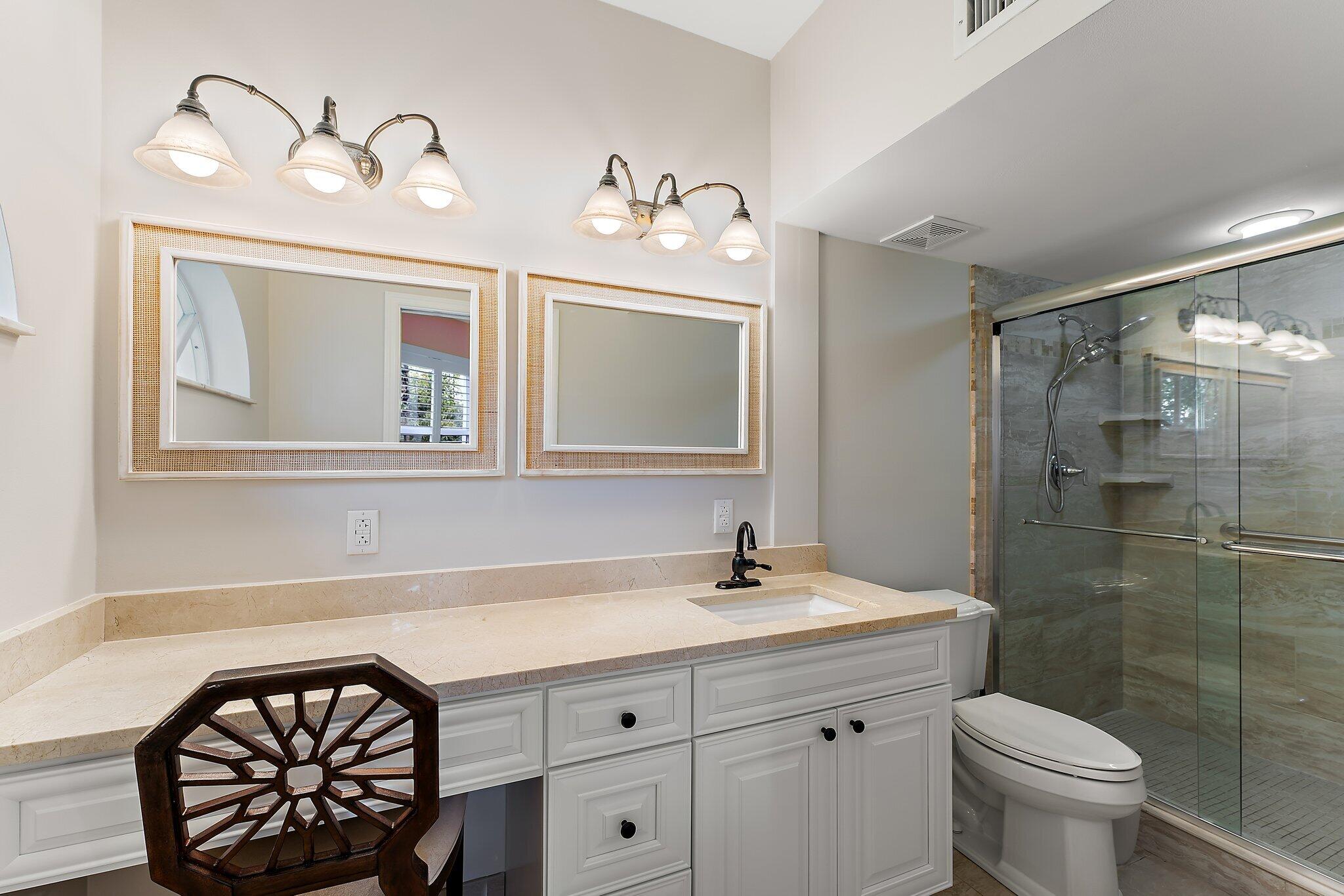 2905 Fairway Drive North Jupiter, FL 33477 - Photo 29 of 65 a bathroom with a sink mirror and toilet