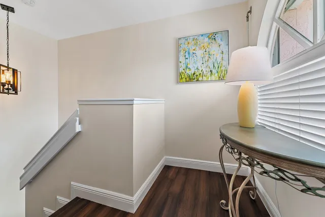 a bathroom with a sink mirror and toilet