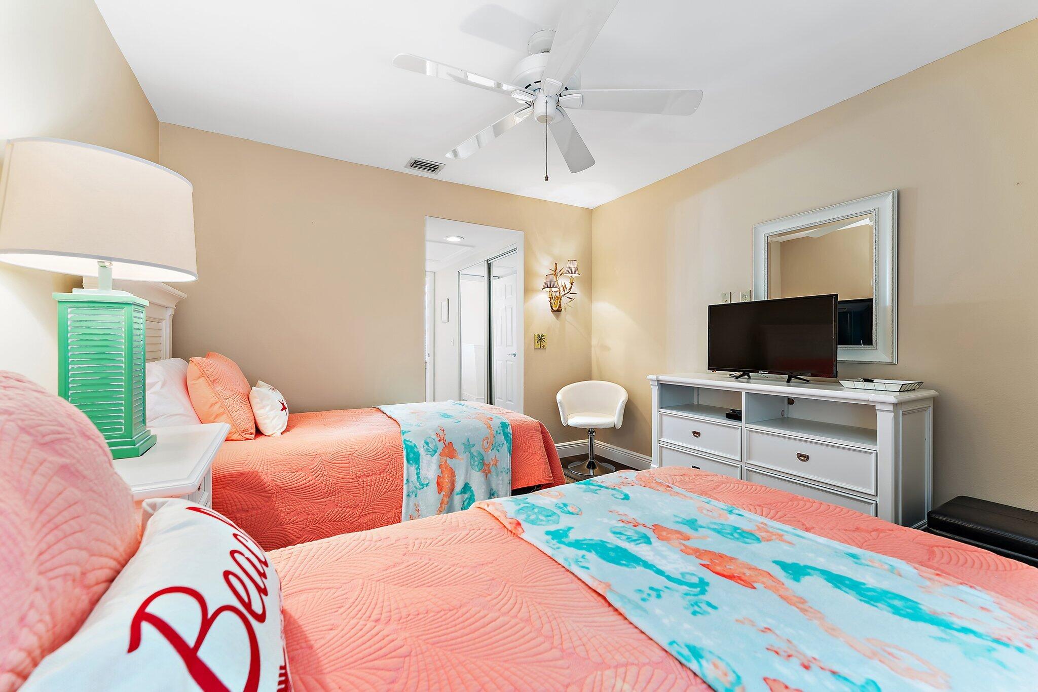 2905 Fairway Drive North Jupiter, FL 33477 - Photo 35 of 65 a bedroom with two bed and a flat screen tv