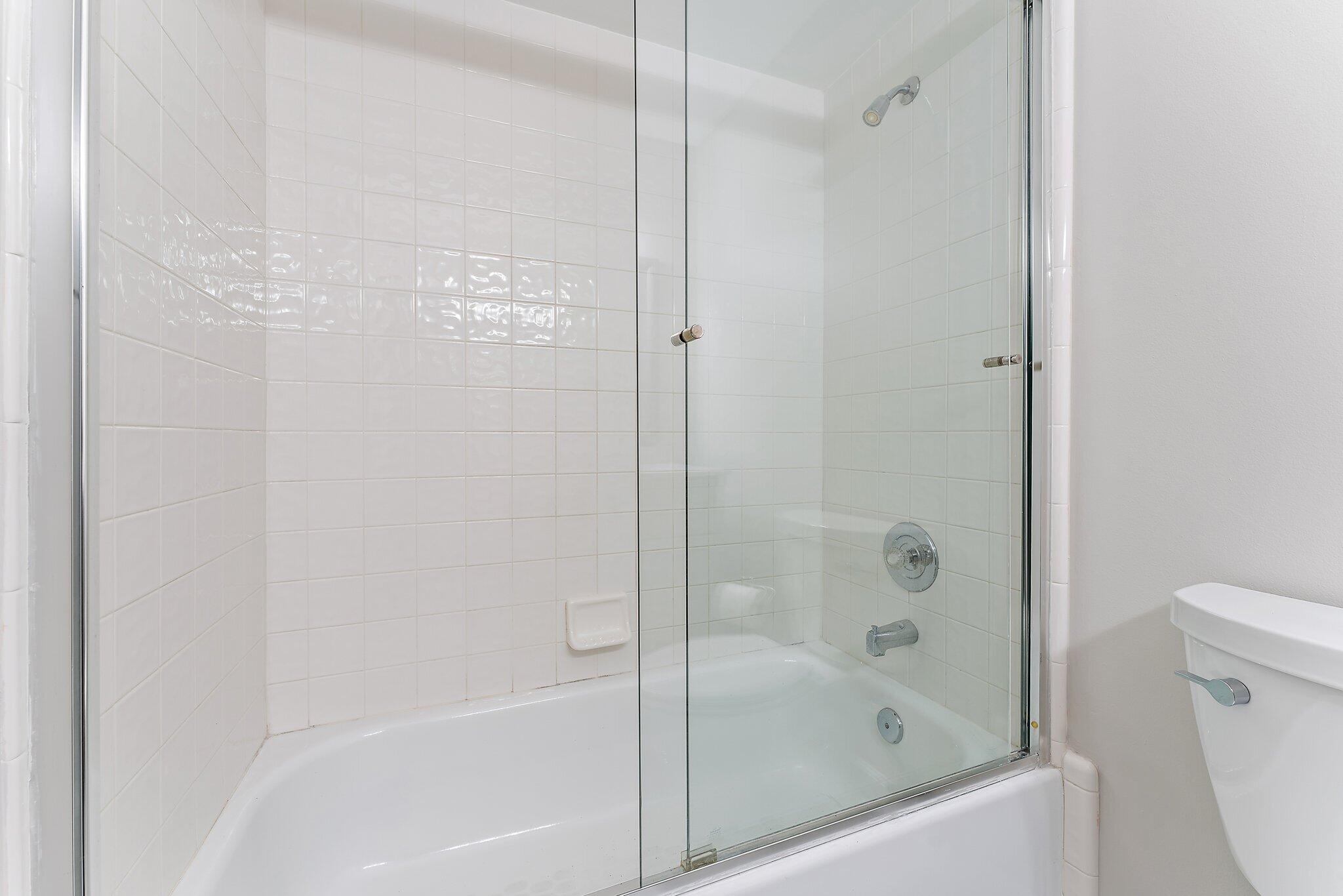 2905 Fairway Drive North Jupiter, FL 33477 - Photo 37 of 65 a bathroom with a bathtub and a shower