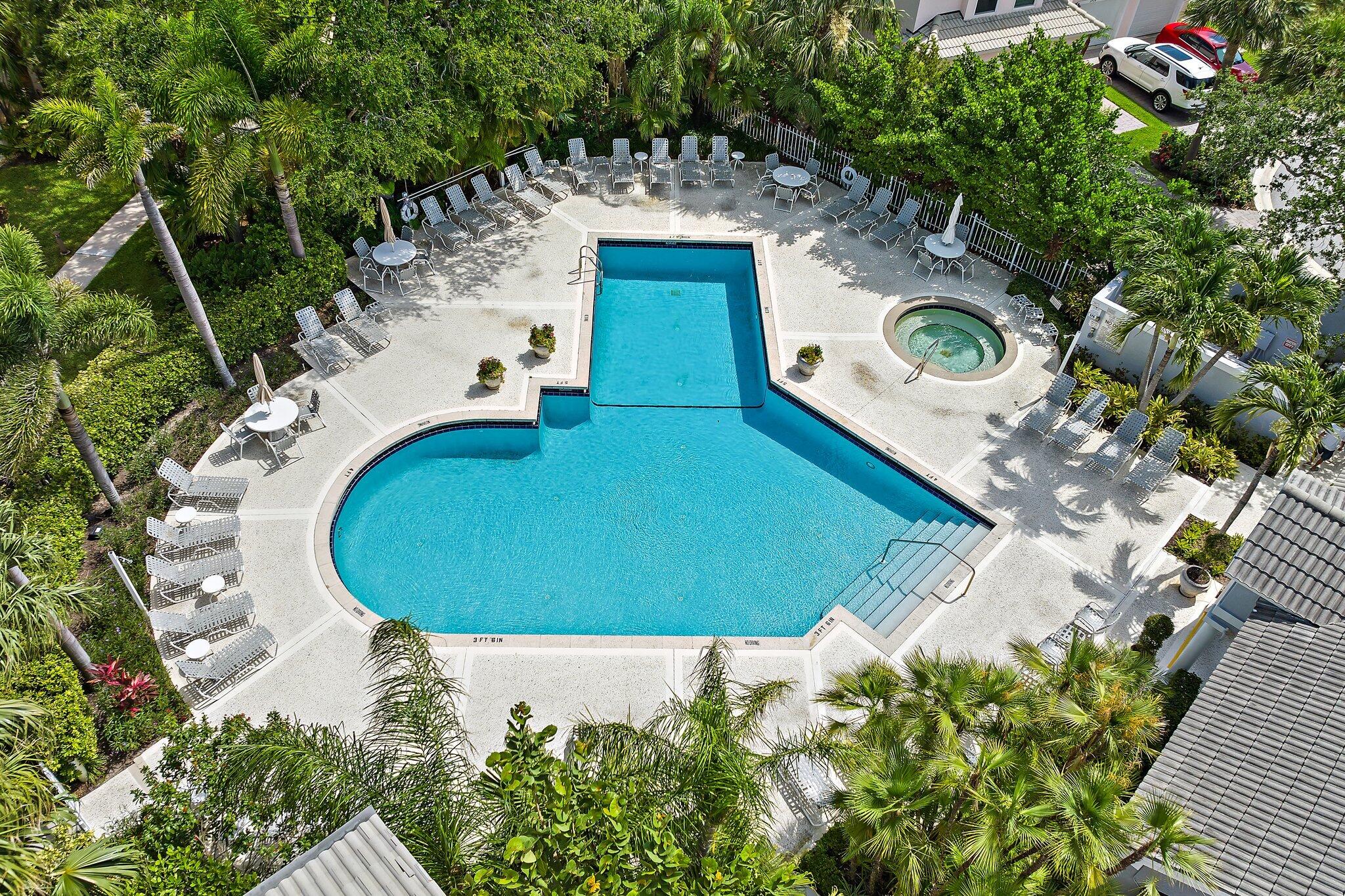 2905 Fairway Drive North Jupiter, FL 33477 - Photo 52 of 65 an aerial view of a house with a swimming pool and garden