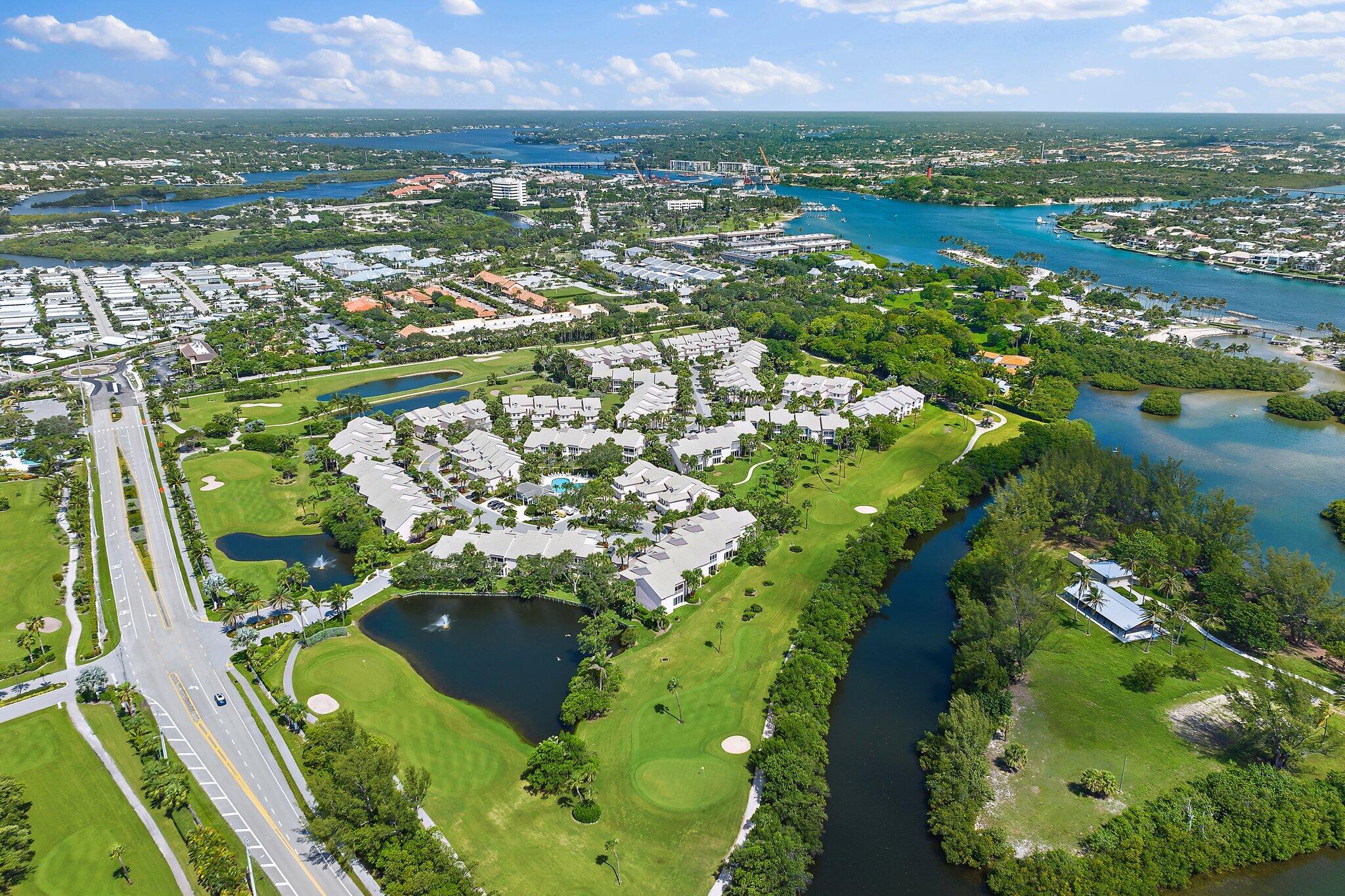 2905 Fairway Drive North Jupiter, FL 33477 - Photo 60 of 65 an aerial view of residential houses with outdoor space and river