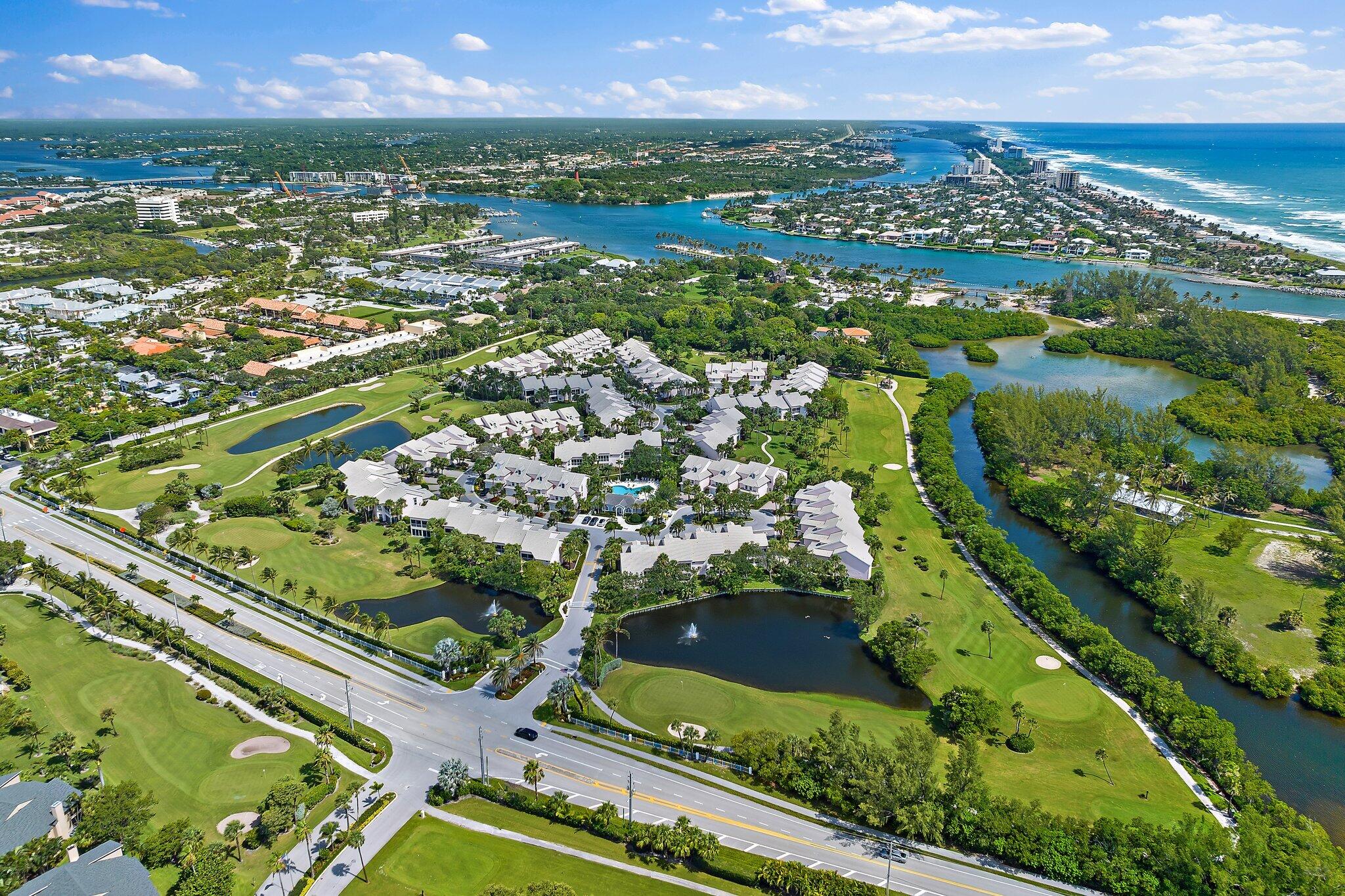 2905 Fairway Drive North Jupiter, FL 33477 - Photo 61 of 65 an aerial view of residential houses with outdoor space and river