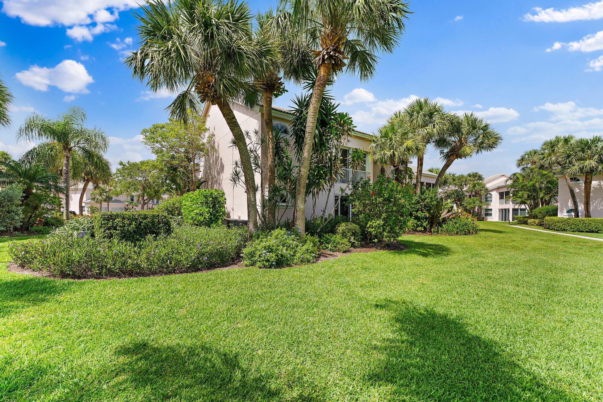 2905 Fairway Drive North Jupiter, FL 33477 - Photo 64 of 65 a view of a yard with a tree
