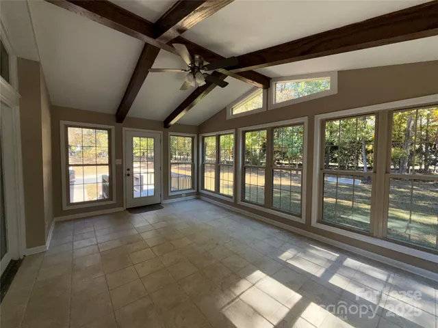 a view of an empty room with a balcony