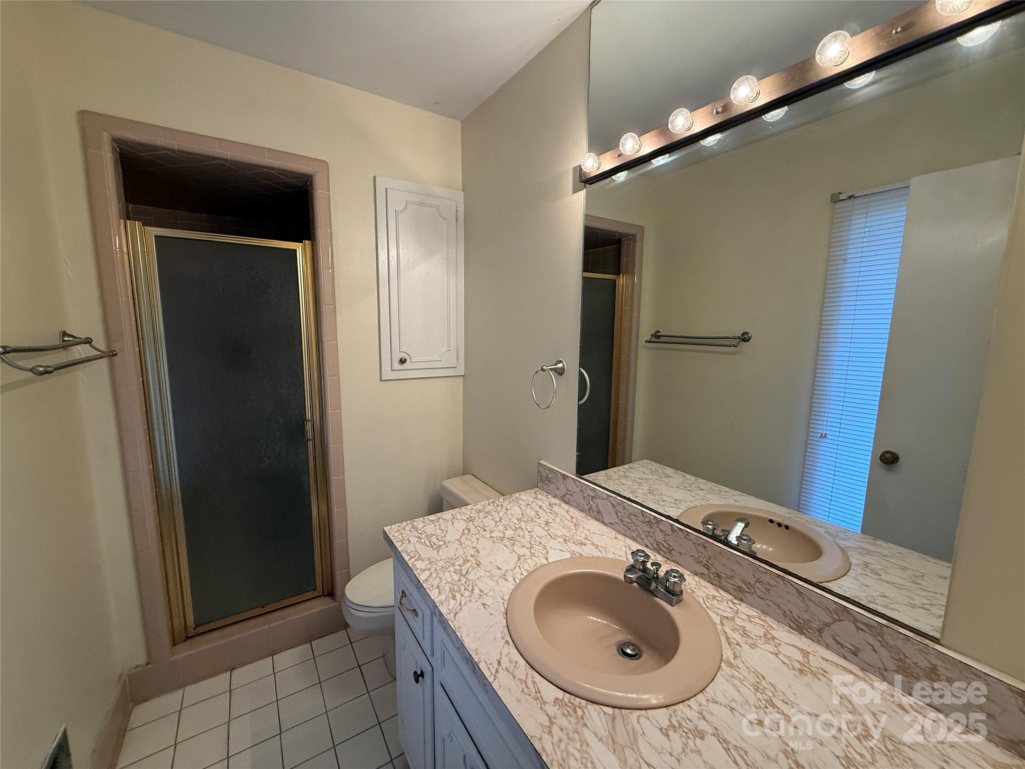 925 Perth Road Troutman, NC 28166 - Photo 23 of 31 a bathroom with a sink and a mirror