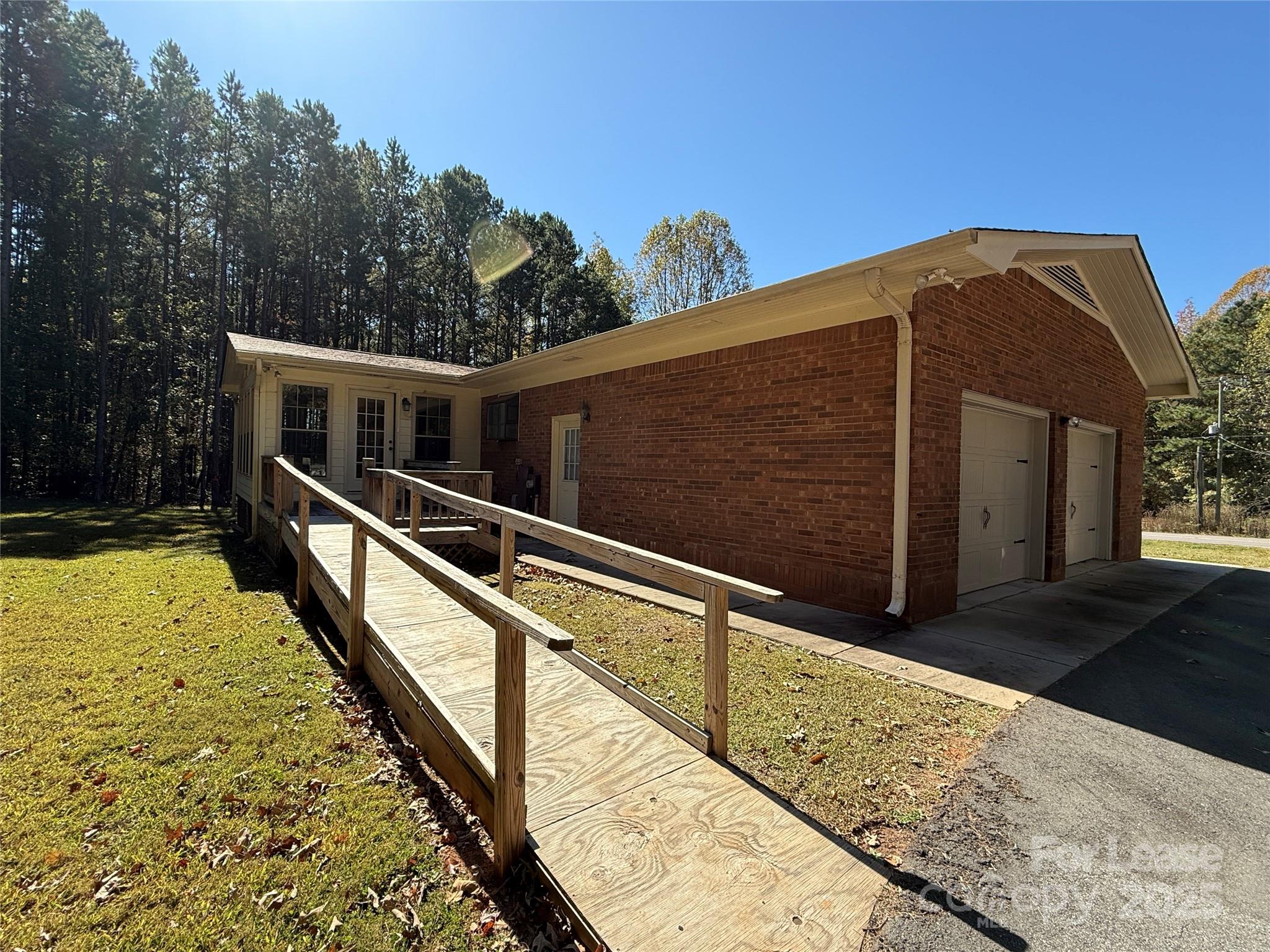 925 Perth Road Troutman, NC 28166 - Photo 26 of 31 a view of a house with backyard and trees