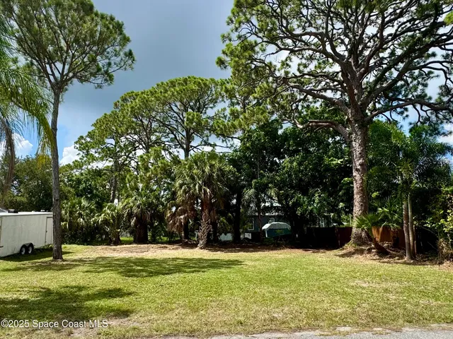 a view of swimming pool with a yard