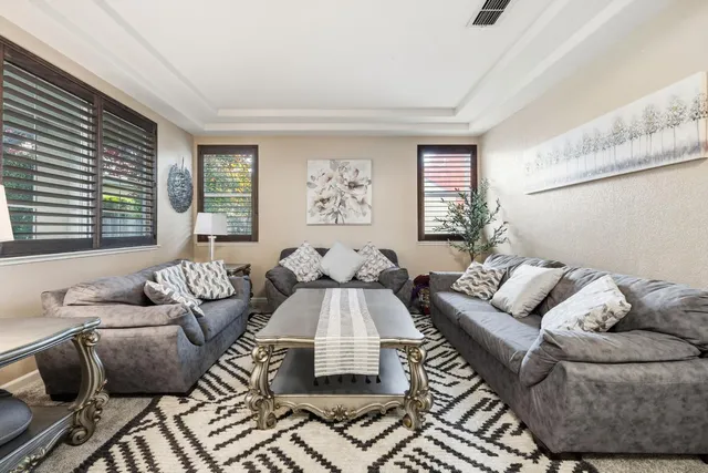 a living room with furniture and windows