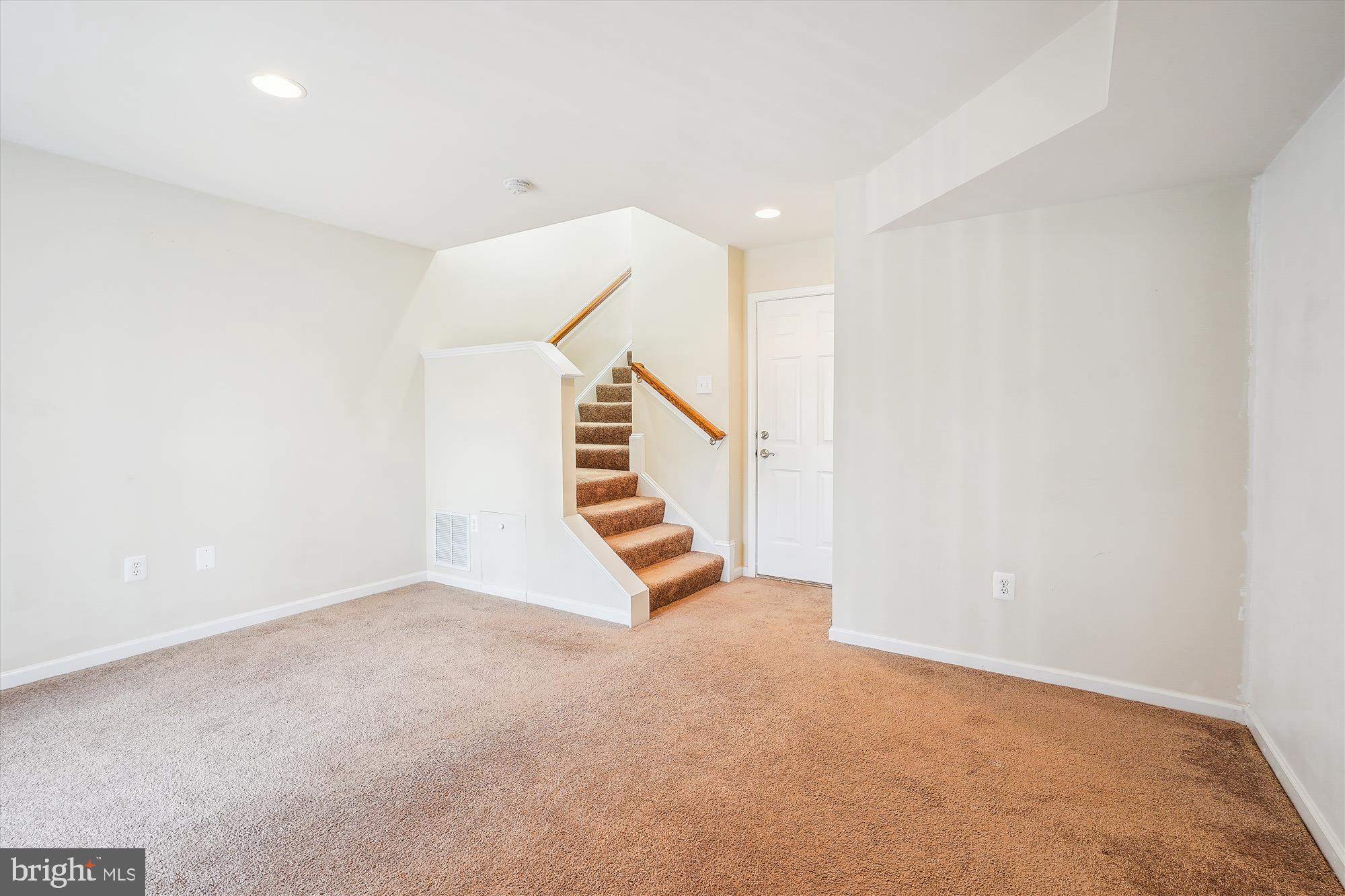 8359 Scotland Loop Manassas, VA 20109 - Photo 17 of 24 a view of an empty room with stairs