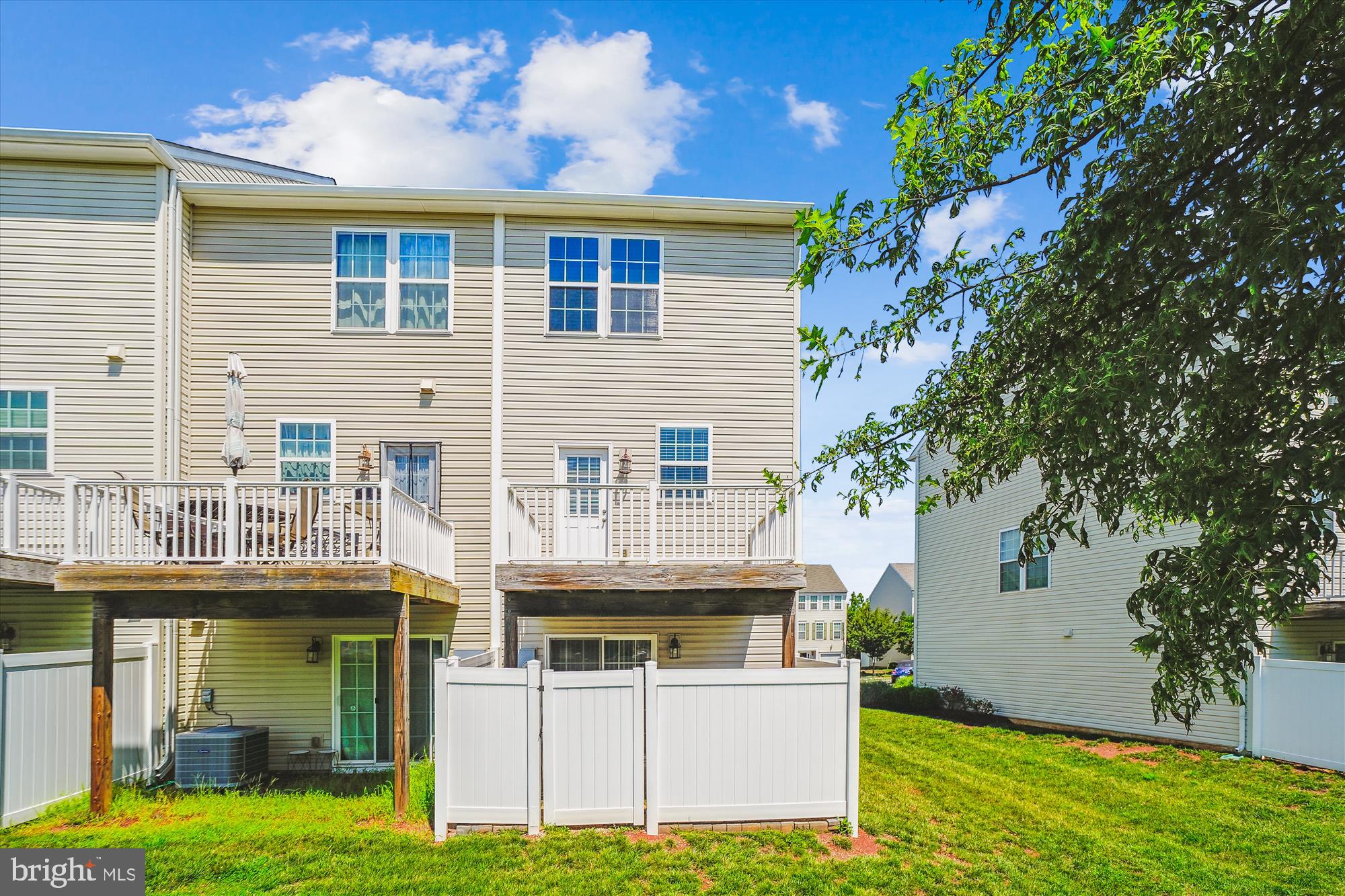 8359 Scotland Loop Manassas, VA 20109 - Photo 20 of 24 a view of a house with a yard and sitting area
