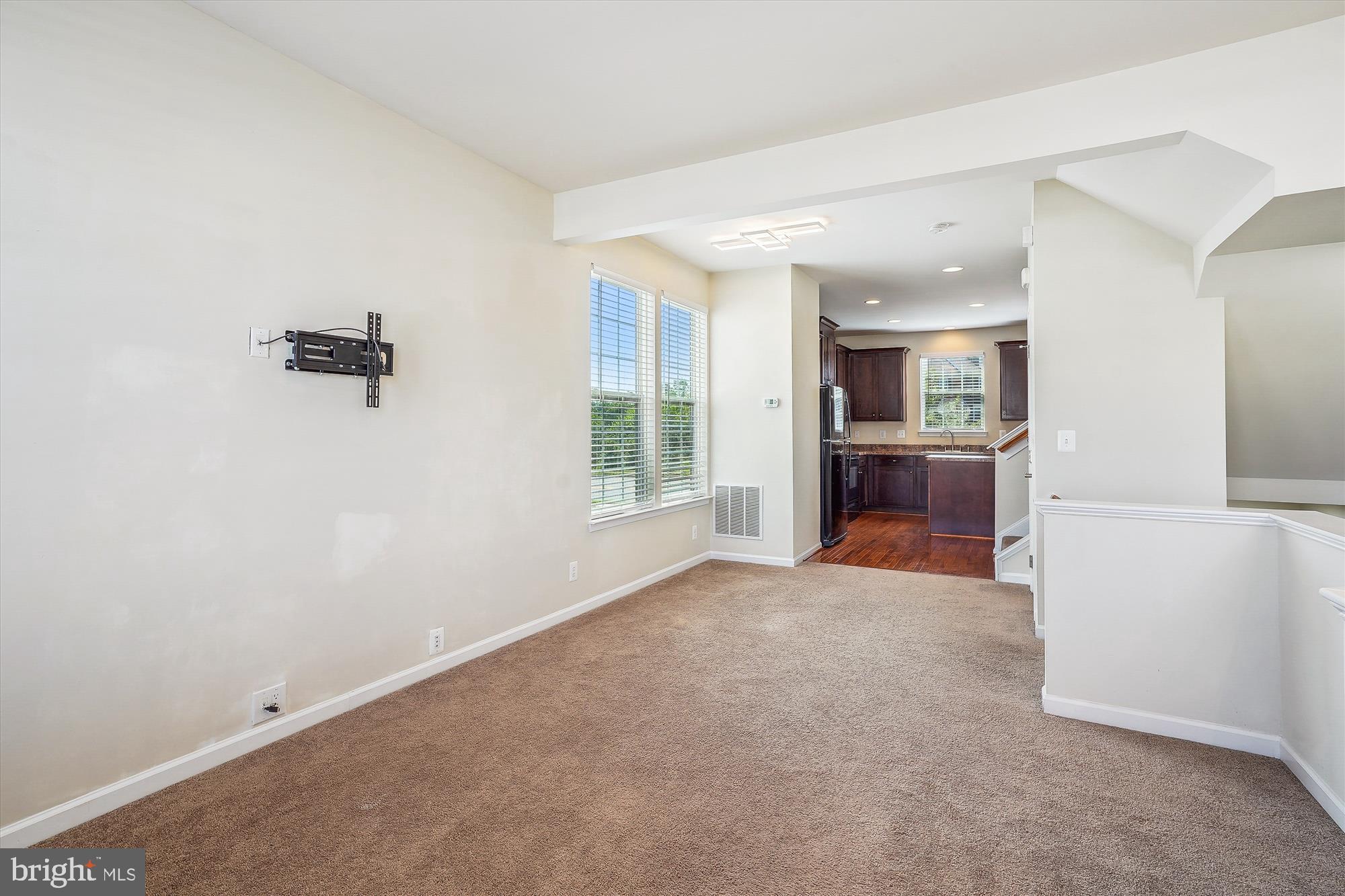 8359 Scotland Loop Manassas, VA 20109 - Photo 6 of 24 an empty room with windows and cabinet