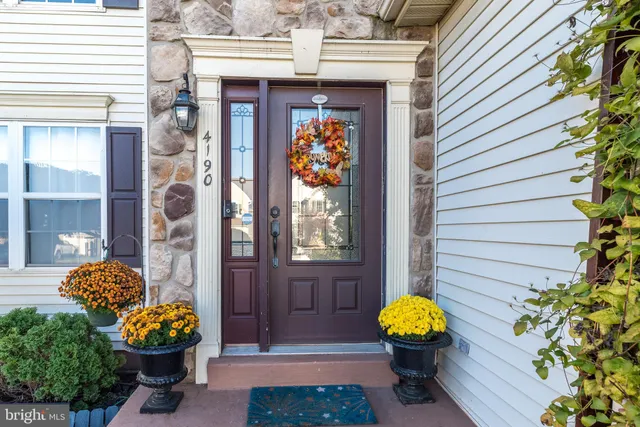 a front view of a house with outdoor seating