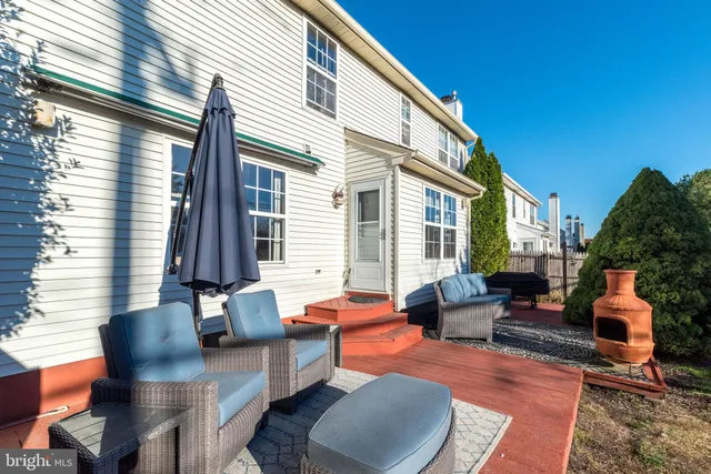a backyard of a house with seating space