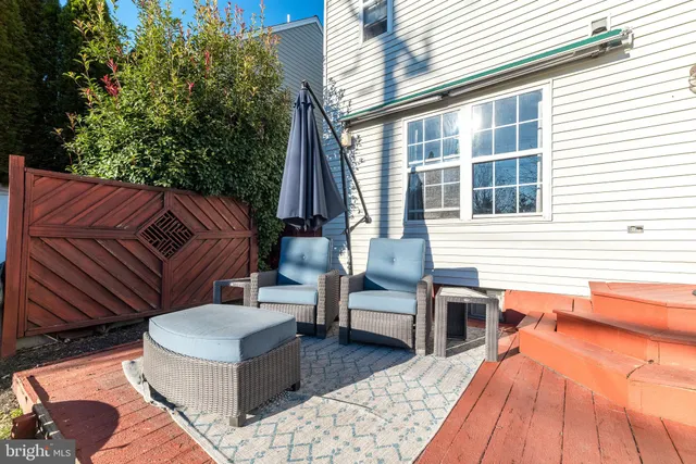 a outdoor space with patio the couches and a dining table with chairs