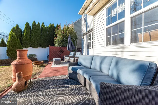 a outdoor living space with furniture and a potted plant