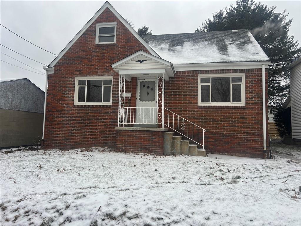 1020 Poe Street Vandergrift, PA 15690 - Photo 1 of 16 a front view of a house with a yard