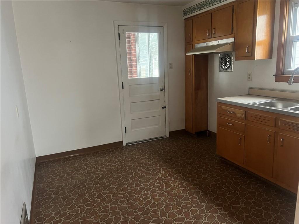 1020 Poe Street Vandergrift, PA 15690 - Photo 7 of 16 a room with storage and utility