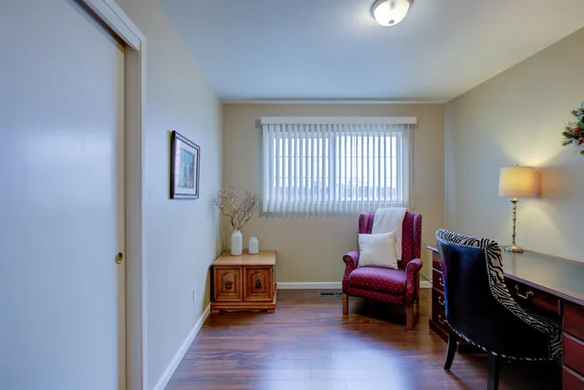a bedroom with furniture and a window