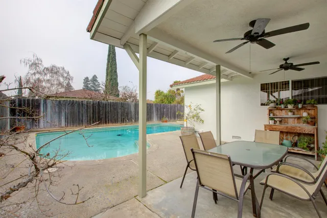 a view of a patio with a table and chairs