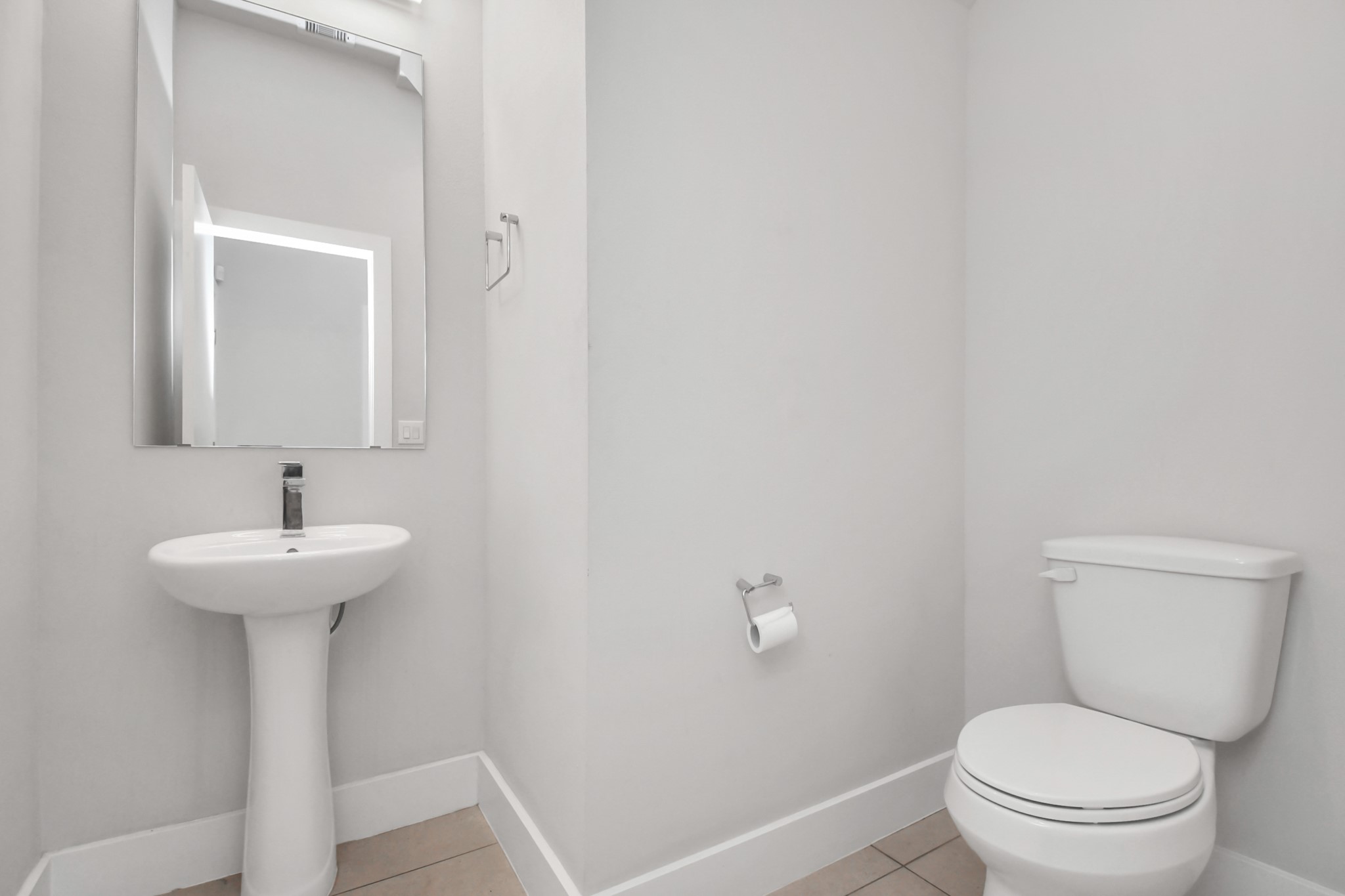 4709 Oats Street Houston, TX 77020 - Photo 12 of 34 a bathroom with a toilet sink and mirror